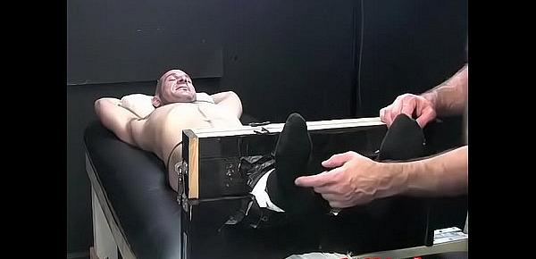  Dark haired dude begging for mercy while tied and tickled